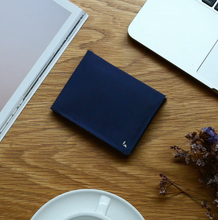 Load image into Gallery viewer, A beautiful and stylish bi-fold wallet that sorts your notes and coins like magic