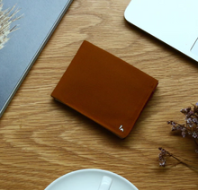 Load image into Gallery viewer, A beautiful and stylish bi-fold wallet that sorts your notes and coins like magic
